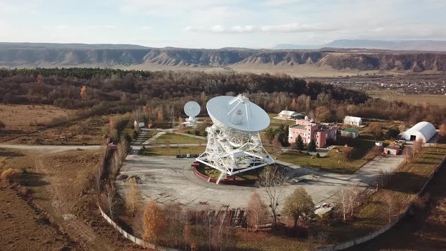 Radio telescope satellite dish, aerial view from drone. Radio Astronomy Observatory Zelenchukskaya, Karachay-Cherkessia, Russia.