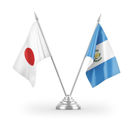 Guatemala and Japan table flags isolated on white 3D rendering