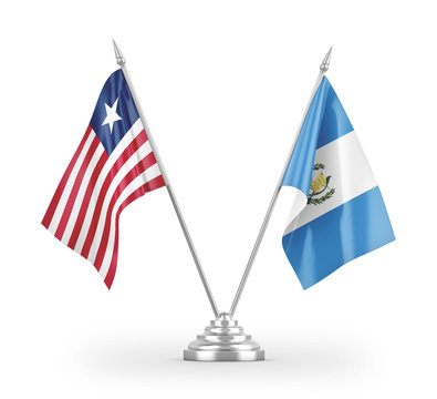 Guatemala and Liberia table flags isolated on white 3D rendering