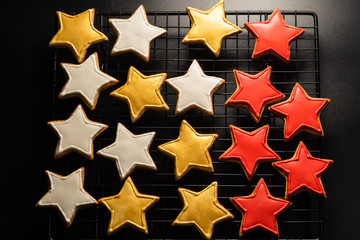 cookies in star shape on a grill on a black background