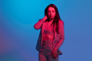 Fashion portrait with color light, shades of red and blue