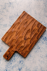 A wood textured oak dark brown cutting board.