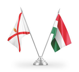 Hungary and Jersey table flags isolated on white 3D rendering