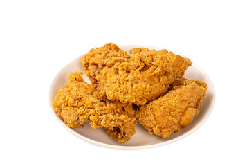 Close Up Fried Chickens on white Plate Isolated on table. Look Yummy and Yellow Gold Color.
