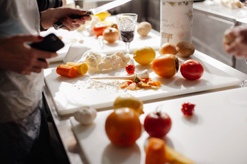 cook cuts vegetables in the kitchen