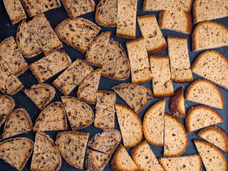 Brown bread croutons with seeds background