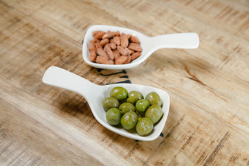 olives in a bowl on a wooden background