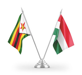 Hungary and Zimbabwe table flags isolated on white 3D rendering