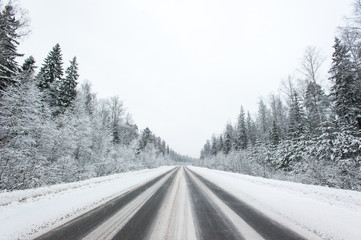 Winter snowy road without cars.