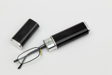 old reading glasses in a black case