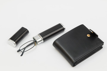 old reading glasses in a black case and wallet