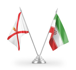 Iran and Jersey table flags isolated on white 3D rendering