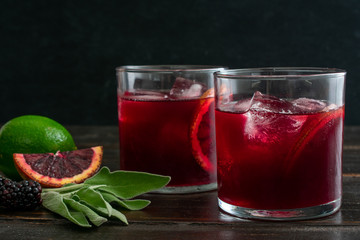 Burnt Sage and Blackberry Sangria: Sangria made with charrged sage leaves, blood oranges, and blackberries steeped in dry red wine