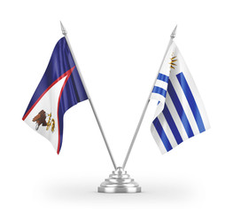 Uruguay and American Samoa table flags isolated on white 3D rendering