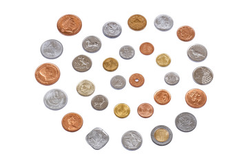 Lots of different coins isolated on white background.