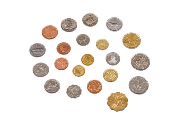 Lots of different coins isolated on white background.