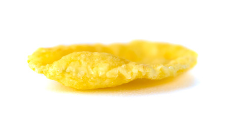 Single cornflake isolated on a white background, dry cereal