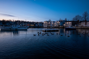 Fototapeta na wymiar Winter sunrise at Rockport Harbor with views of Motif #1 - Rockport, Massachusetts.
