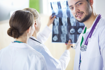 Medical doctors analysing x-ray photography in hospital
