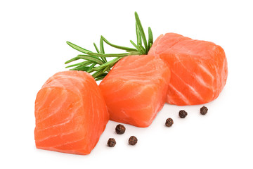 raw salmon piece cube with rosemary and peppercorn isolated on white background close up