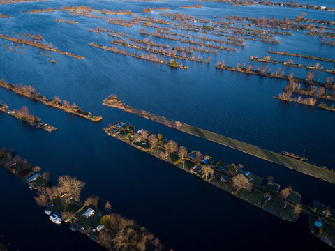 Stunning aerial view of a water city, small house and boat houses showed, blue view, Vinkeveen, Netherlands. 