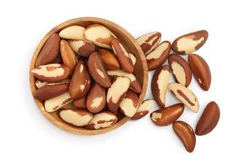 Brasil nuts in wooden bowl isolated on white background with clipping path and full depth of field. Top view. Flat lay