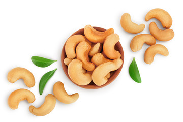 Roasted Cashew nuts in bowl isolated on white background with clipping path and full depth of field. Top view with copy space for your text. Flat lay