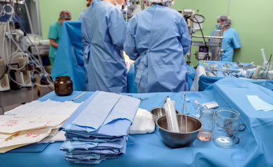 Surgical instruments in operating room on table.
