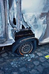 Burned european ambulance tire closeup arson in Schoneberg Berlin Germany