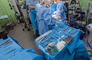 Surgical instruments in operating room on table.