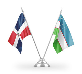 Uzbekistan and Dominican Republic table flags isolated on white 3D rendering