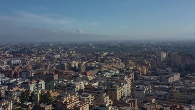 Aerial view of residential district of Rome, Italy. Tilt up establishing shot.