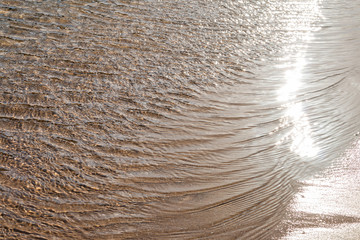 Wave of the sea on the sand beach