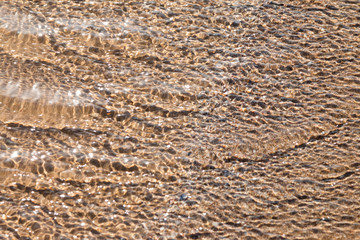 Wave of the sea on the sand beach