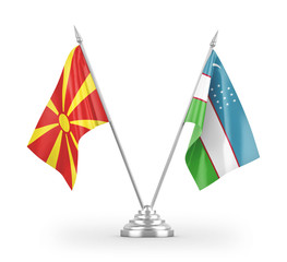 Uzbekistan and North Macedonia table flags isolated on white 3D rendering
