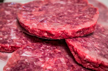 Hamburger raw meat preparation close up