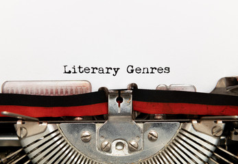 Literary genres title text written on paper with typewriter