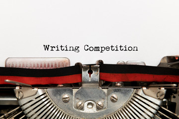 Writing competition title text written on paper with typewriter
