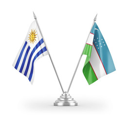 Uzbekistan and Uruguay table flags isolated on white 3D rendering