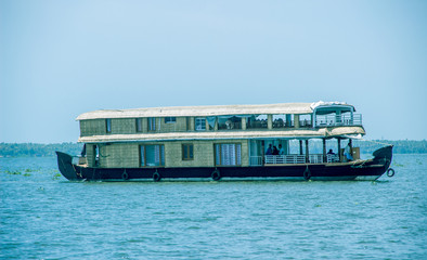 A shot of Alleppey boat house with horizon in the background