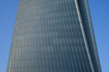 modern office building with reflection in windows of building