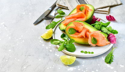 Popular keto diet : salmon and avocado  with arugula and lime. healthy lunch. ketogenic diet  food