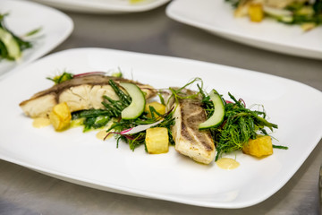baked fish with vegetables and radish