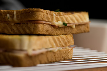 Close up of grilled toast with cheese ham and parsley a delicious snack