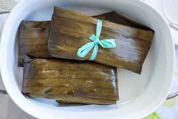 Steamed tamales served on a plate