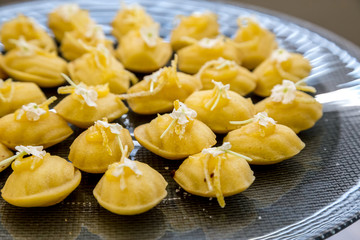 Madeleine's on a tray with flowers sweat pastries