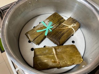 Steamed tamales served on a plate