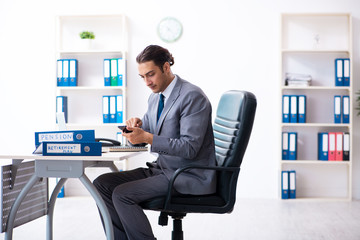 Young male accountant working in the office