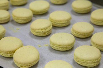 yellow macaroons on a tray