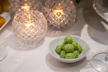 herb butter balls on table with candles